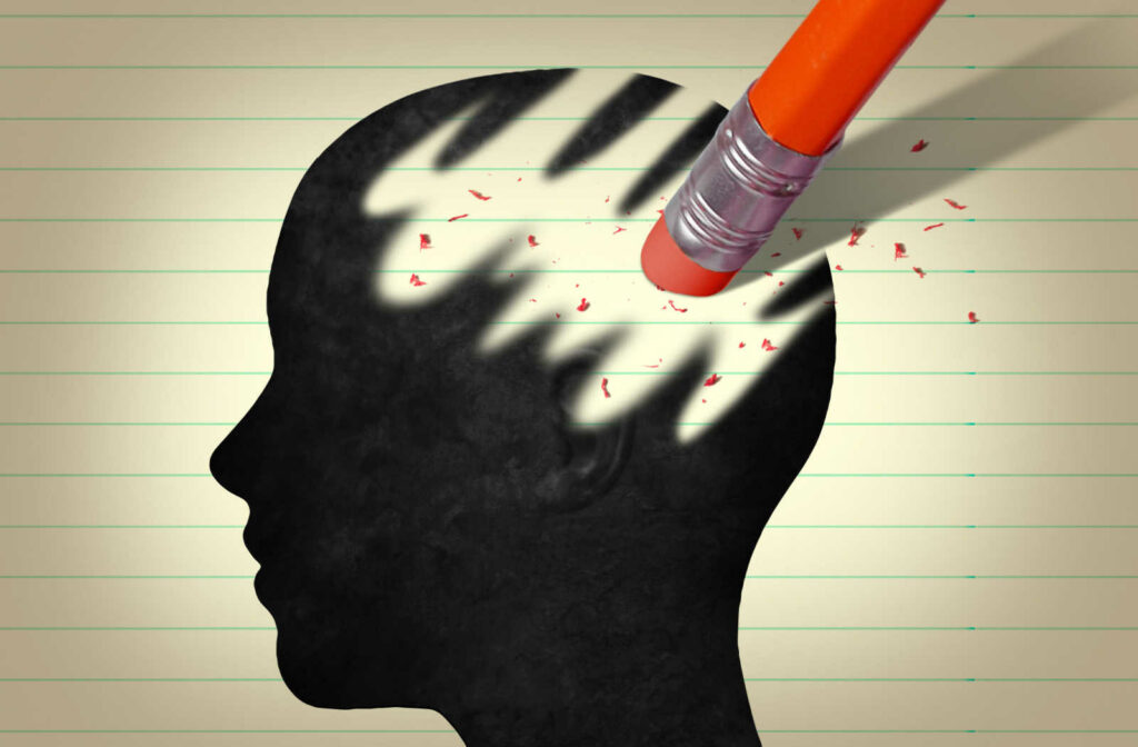 A silhouette image of a human head and part of it getting erased using a pencil eraser. A representation of memory loss.