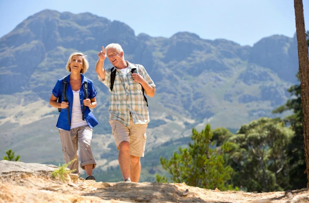 Two seniors go on a hike to stay active, engaged and healthy.