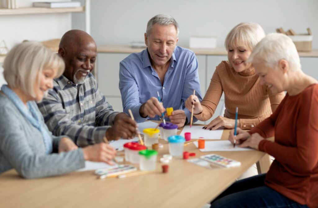 seniors doing a craft at a table